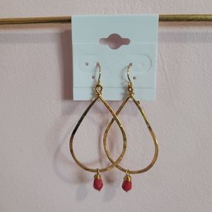 Gold earrings with red bead